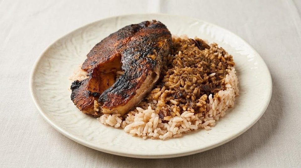 Menu board listing Jamaican dishes and sides.